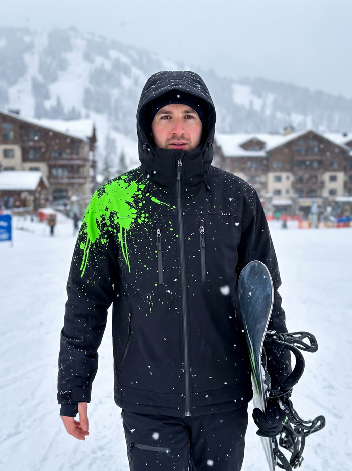 Rider walking through falling snow in the Electric Green StormShift colorway